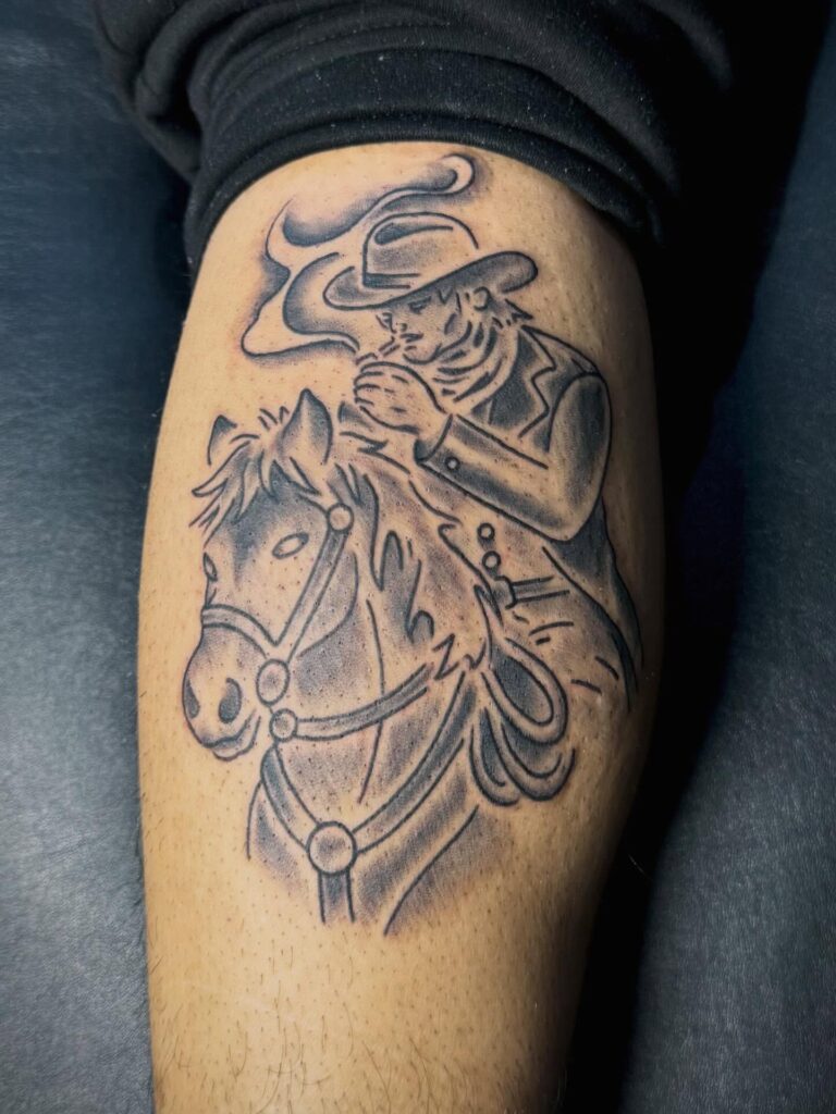 Tattoo design featuring a cowboy with a horse, emphasizing Western themes and artistry.